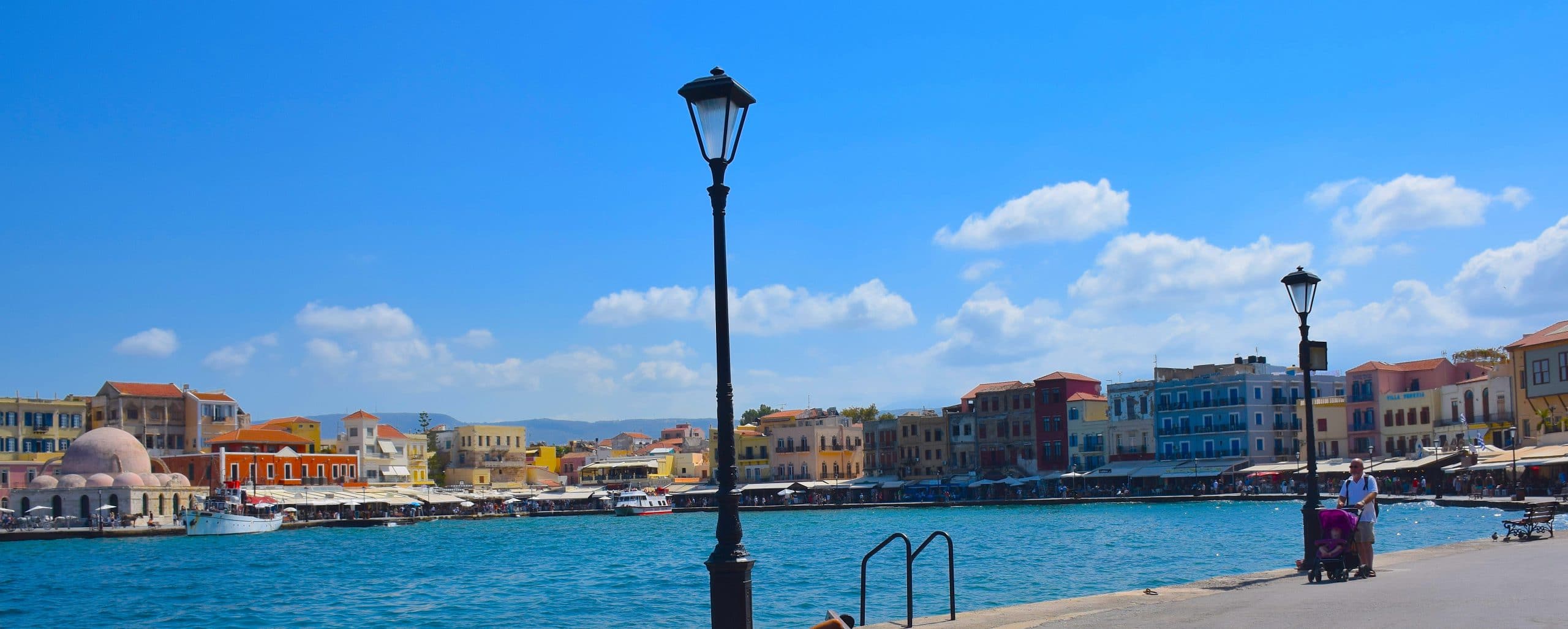 panoramic of Chania's Medieval Harbor, ringed by restaurants